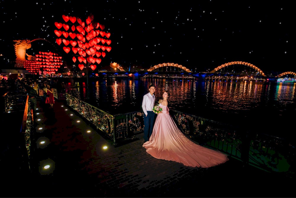 Lots of Vietnamese couples take wedding photos at the Love Lock Bridge